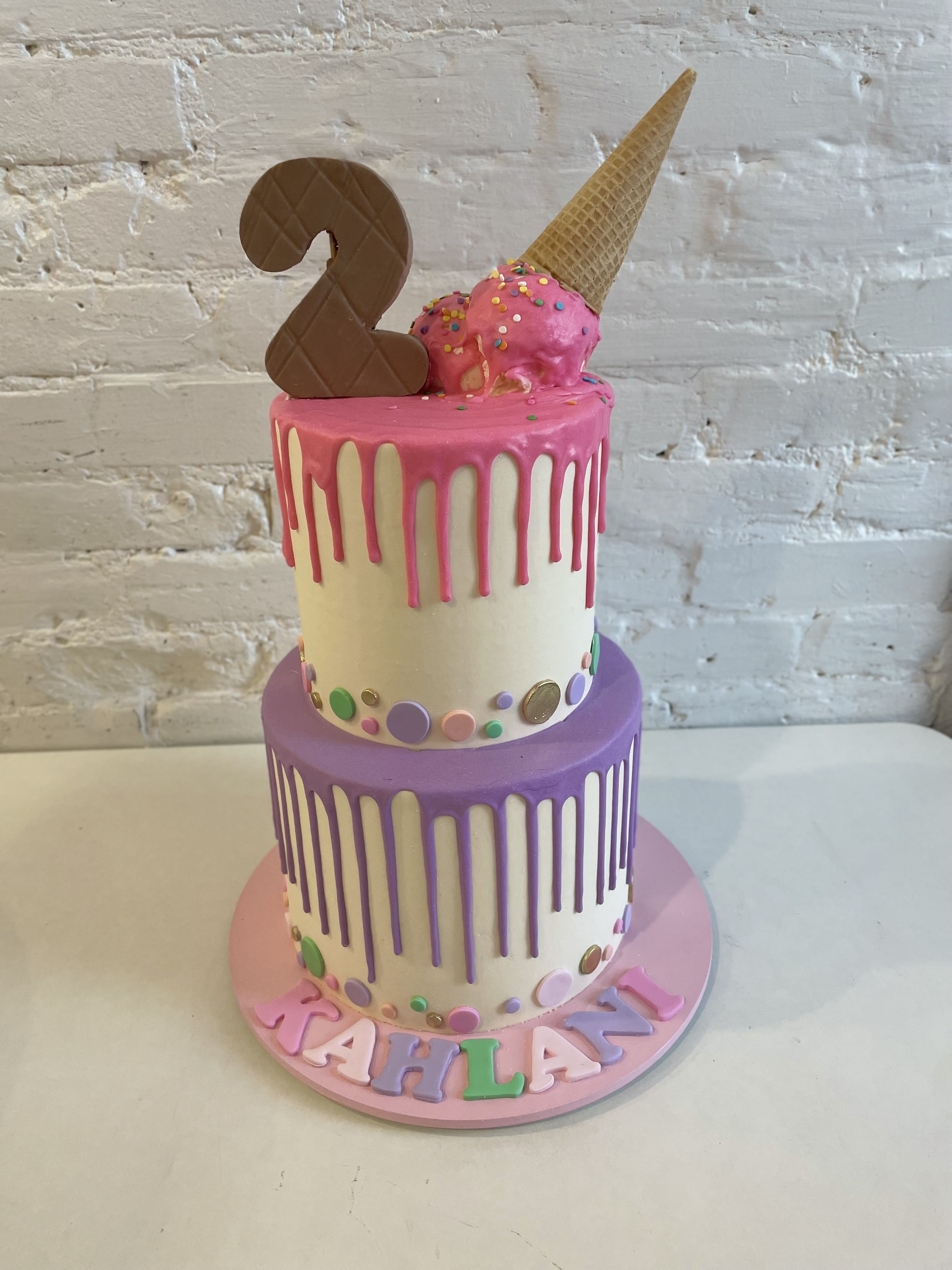 Two-tier ice cream themed cake by Sugary Dreams