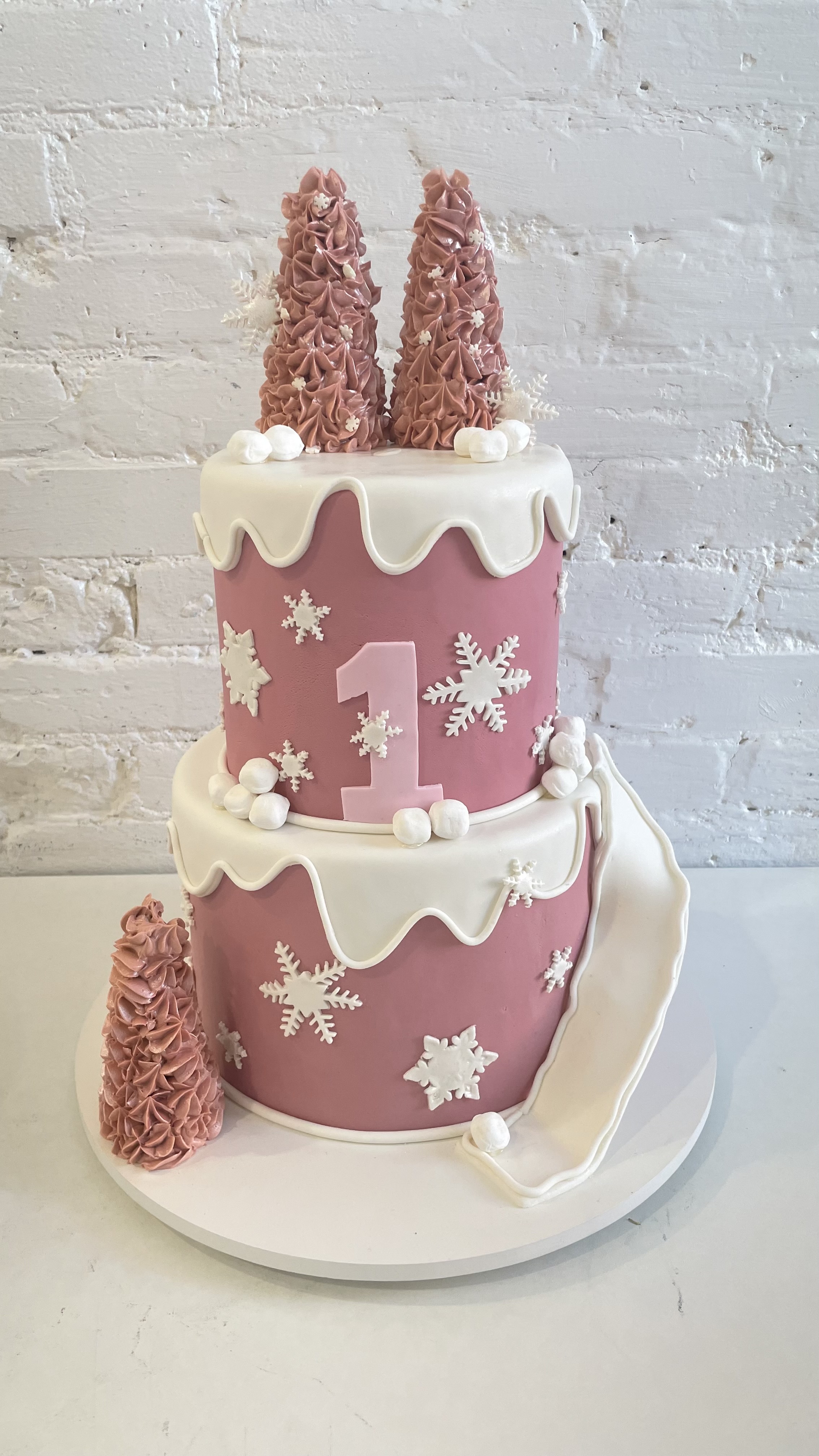 Pink winter first birthday cake by Sugary Dreams